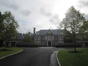 Residential property inspected — brick mansion with curved driveway 3
